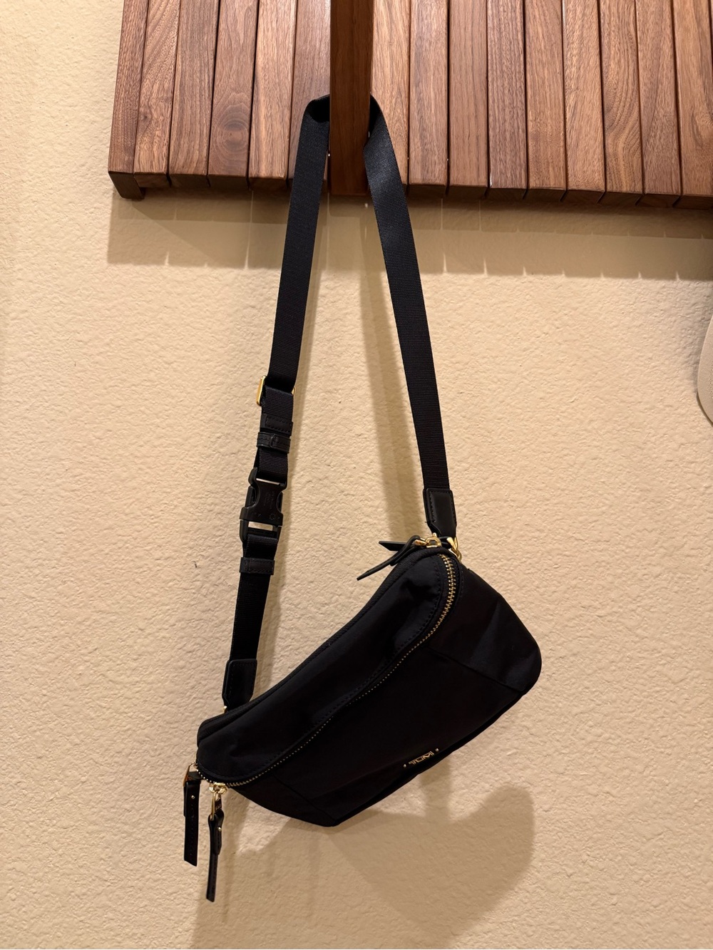 Tumi Black Crossbody Belt Bag with Gold Hardware